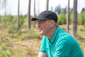 Man with thoughts in forest